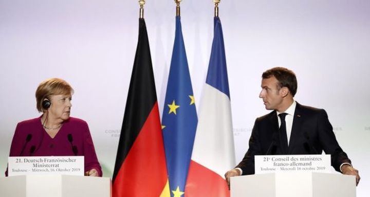 Ангела Меркел и Еманюел Макрон по време на пресконференцията им в Тулуза