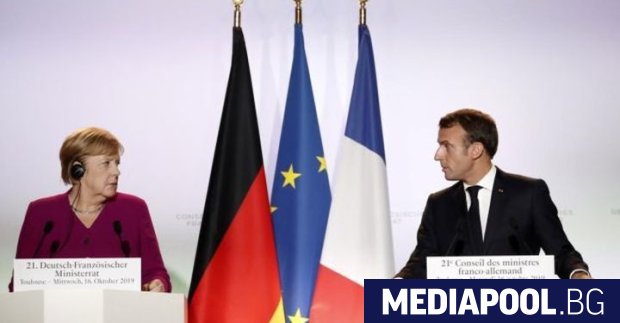 Президентът на Франция Еманюел Макрон канцлерът Меркел и председателят на
