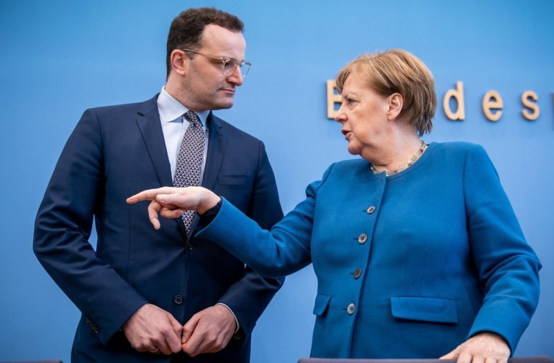 Йенс Шпан и Ангела Меркел